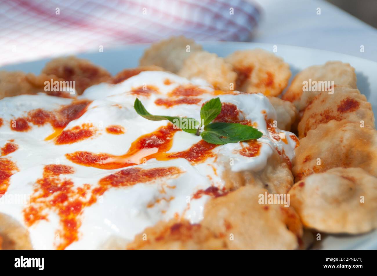 Puff pastry with yoghurt and tomato sauce Stock Photo Alamy
