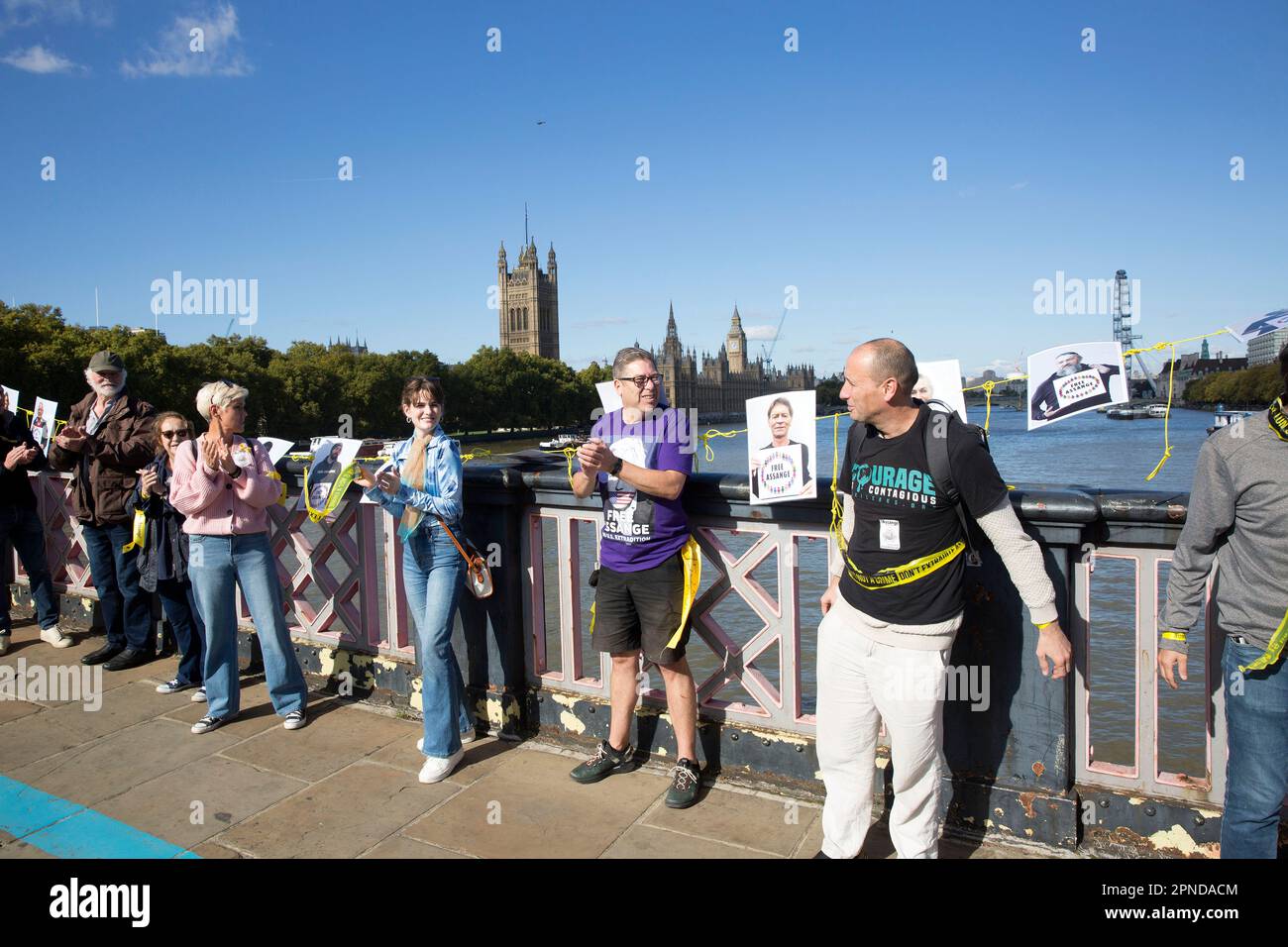 Supporters of WikiLeaks founder Julian Assange gather to form a human chain around the Houses of Parliament in London. Stock Photo