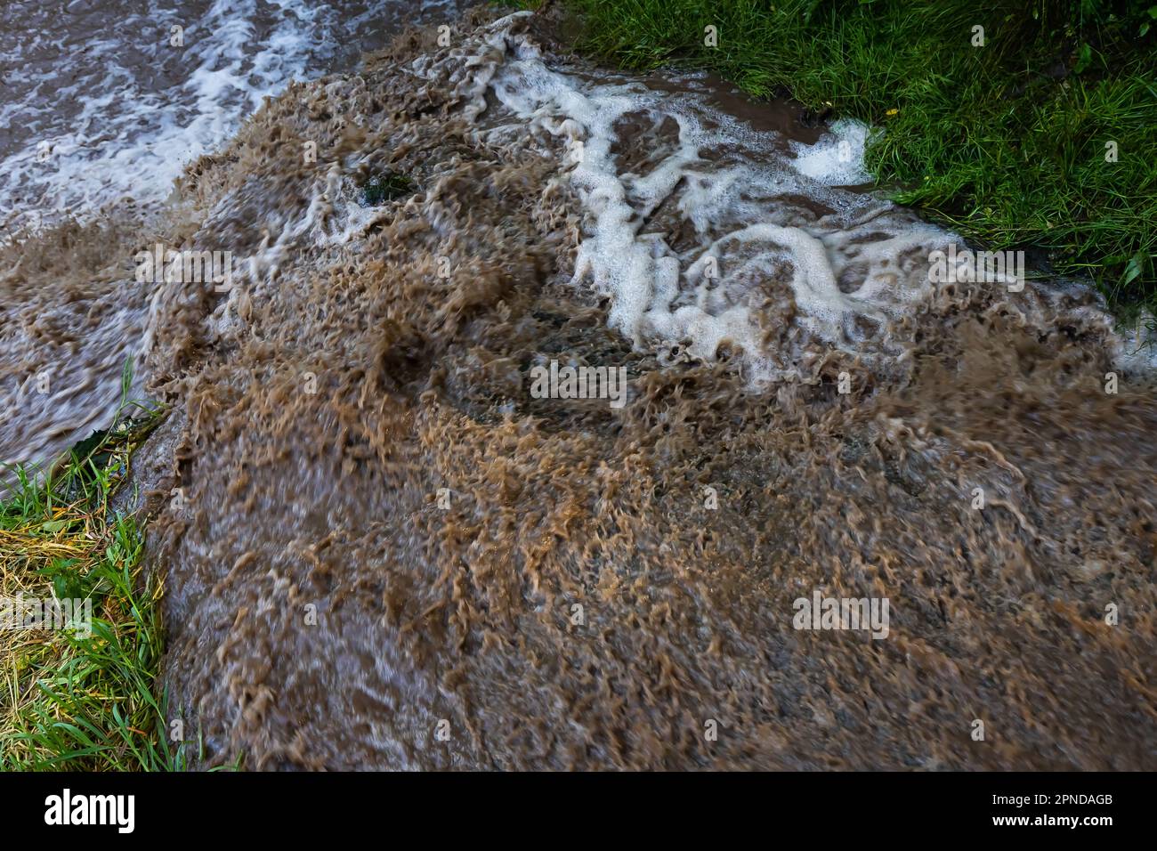 powerful waterfall with dirty water after the hard rain Stock Photo