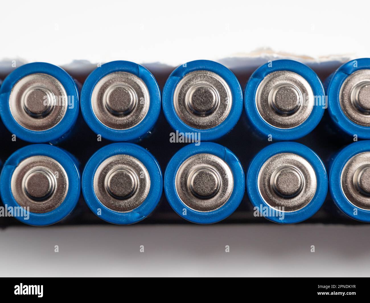 Alkaline batteries on a light background. The concept of energy sources