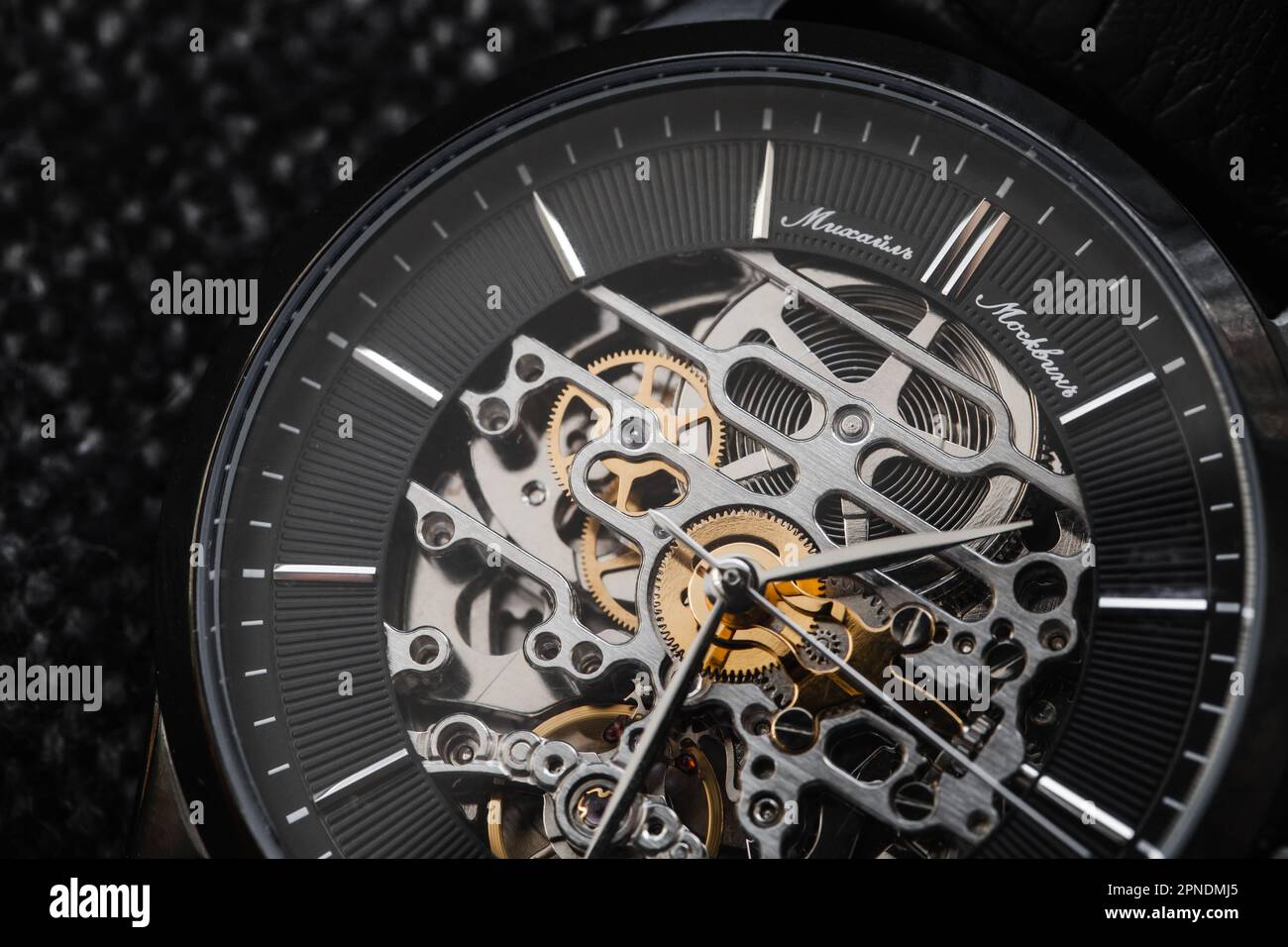 Uglich, Russia - February 1, 2021: Mikhail Moskvin skeleton watch by Uglich Watch Factory, macro photo of black clock face and automatic movement Stock Photo