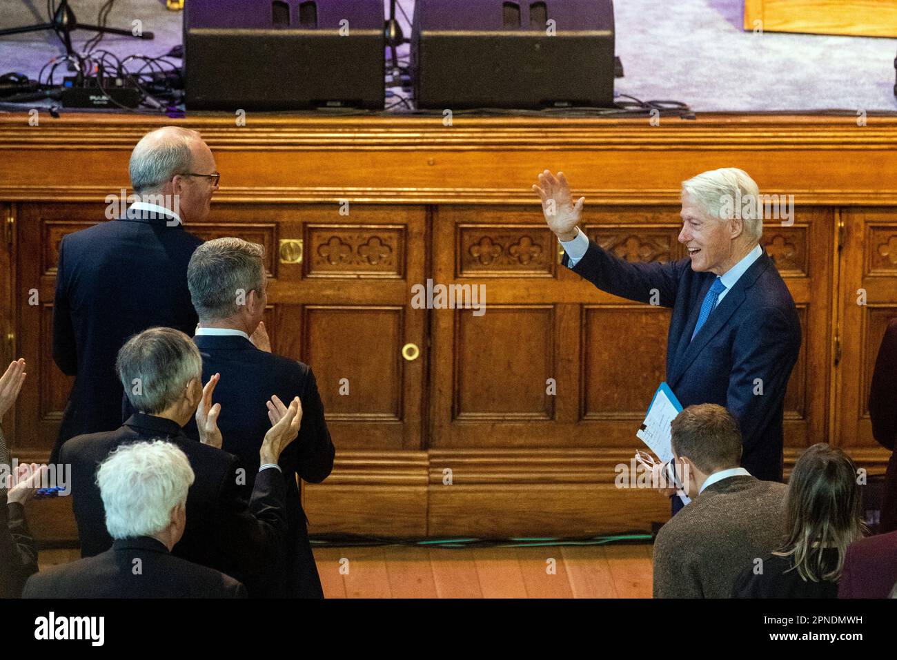 Former US president Bill Clinton waves as he is given a standing ...