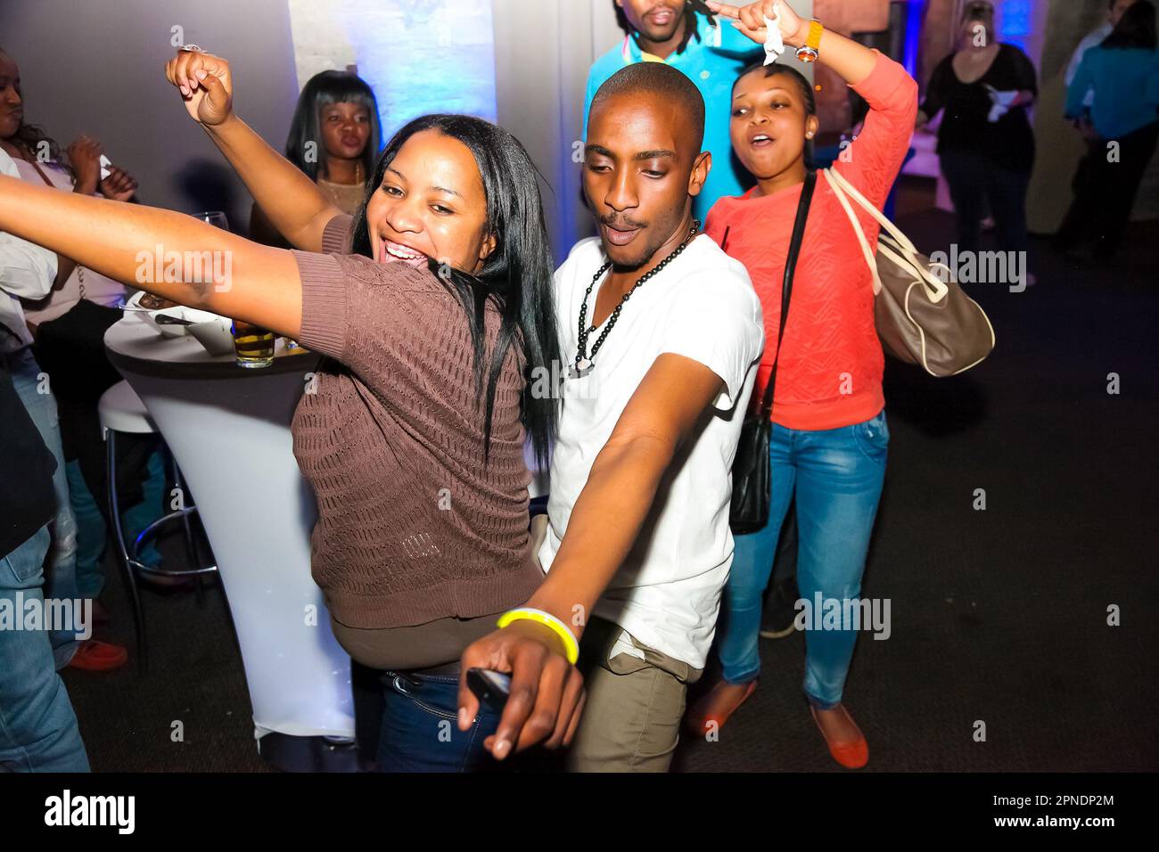 A young African American couple enjoying a night out at a