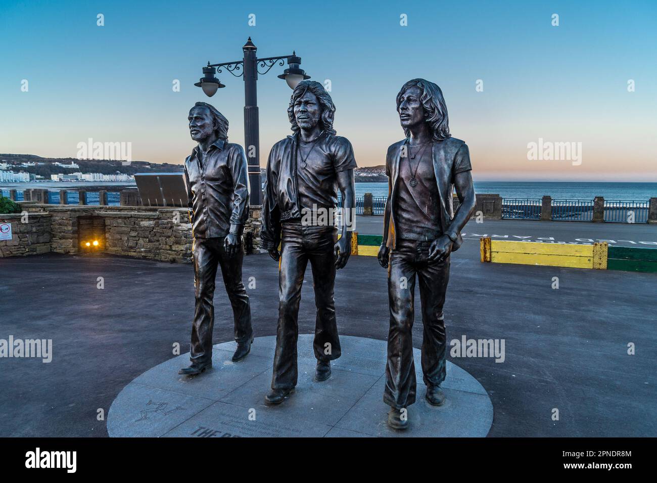 Bronze statue of the Bee Gees pop group by Andy Edwards, 2021, Loch Promenade, Douglas, Isle of Man Stock Photo