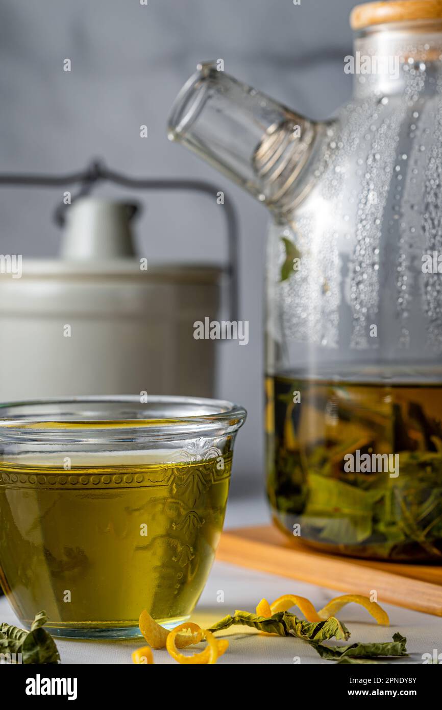 Infused green tea with herbs. Portrait format Stock Photo Alamy