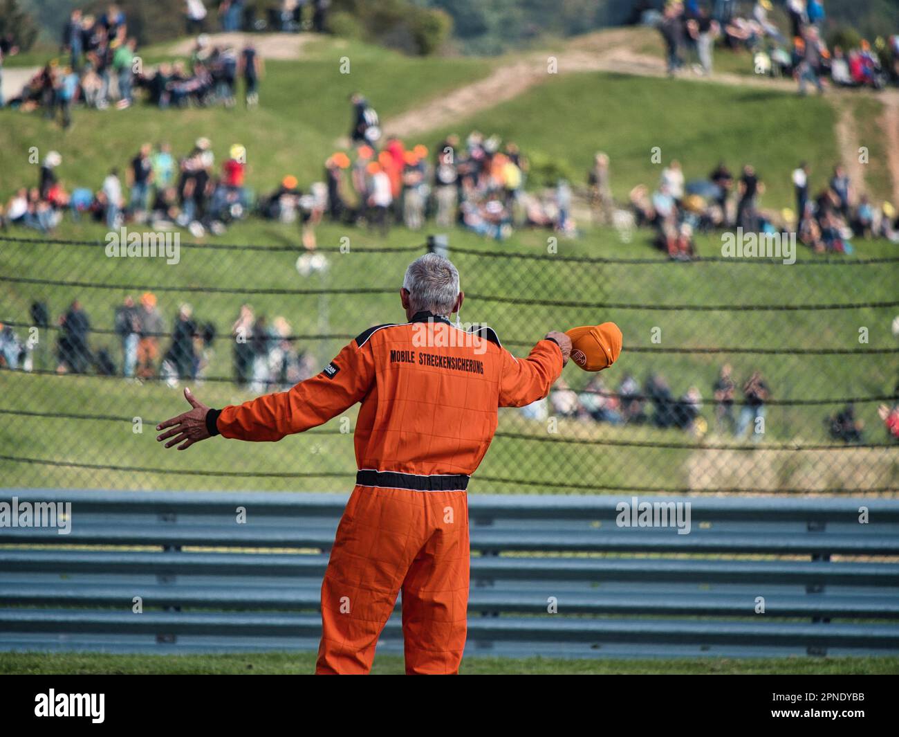 Marshal with Fans after Race Stock Photo