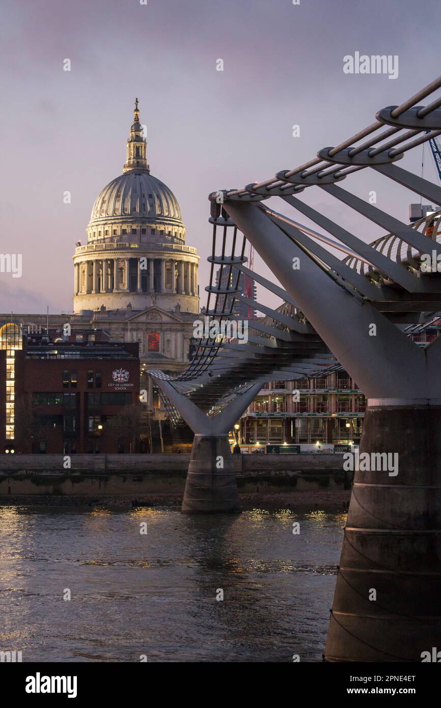 St. Pauls Cathedral and the Millennium Bridge at dusk Stock Photo