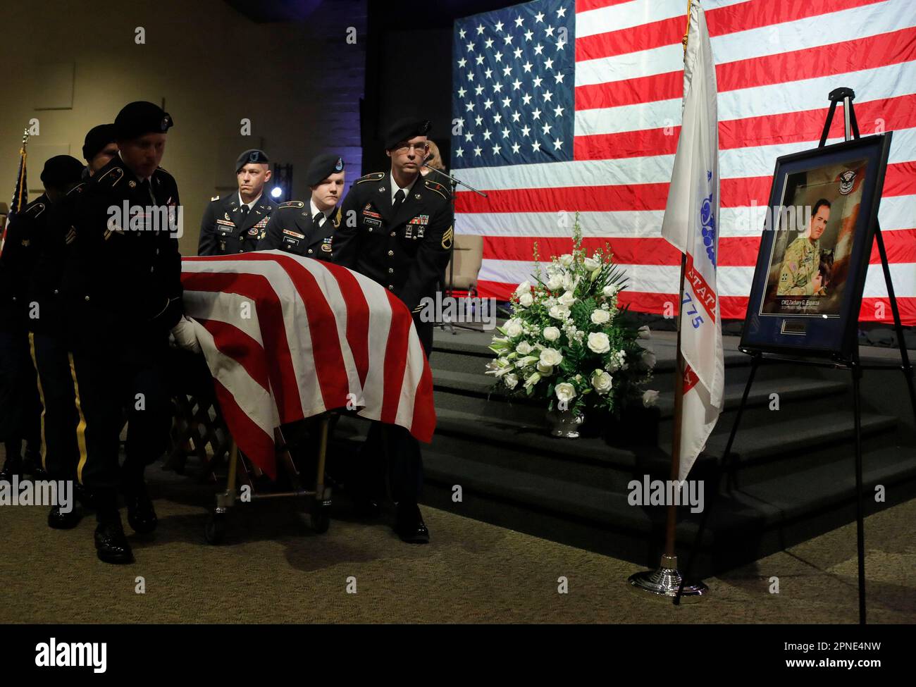 Pallbearers carry the casket of U.S. Army Chief Warrant Officer 3