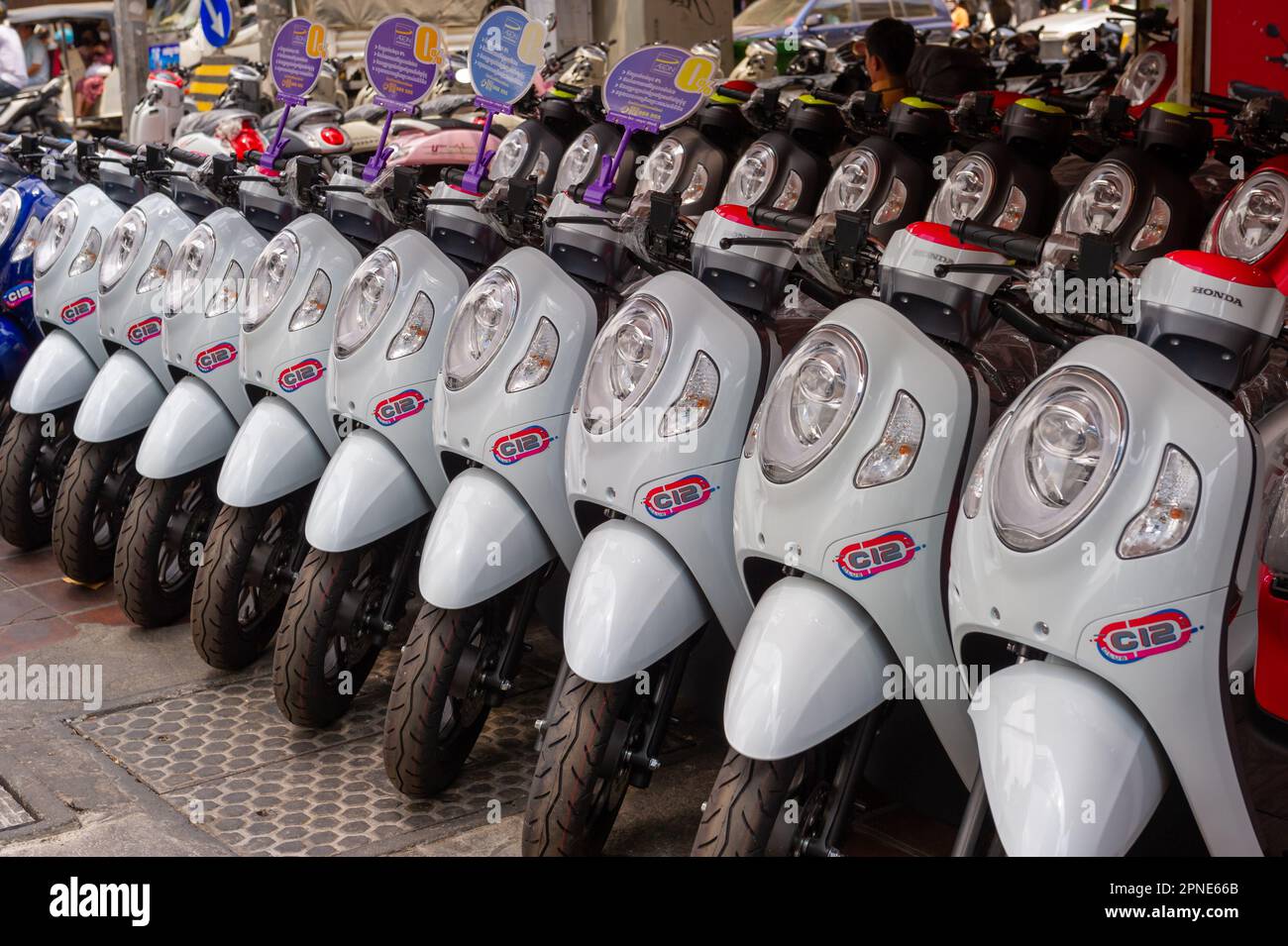 New motorcycles lined up for sale in Phnom Penh, Cambodia Stock Photo