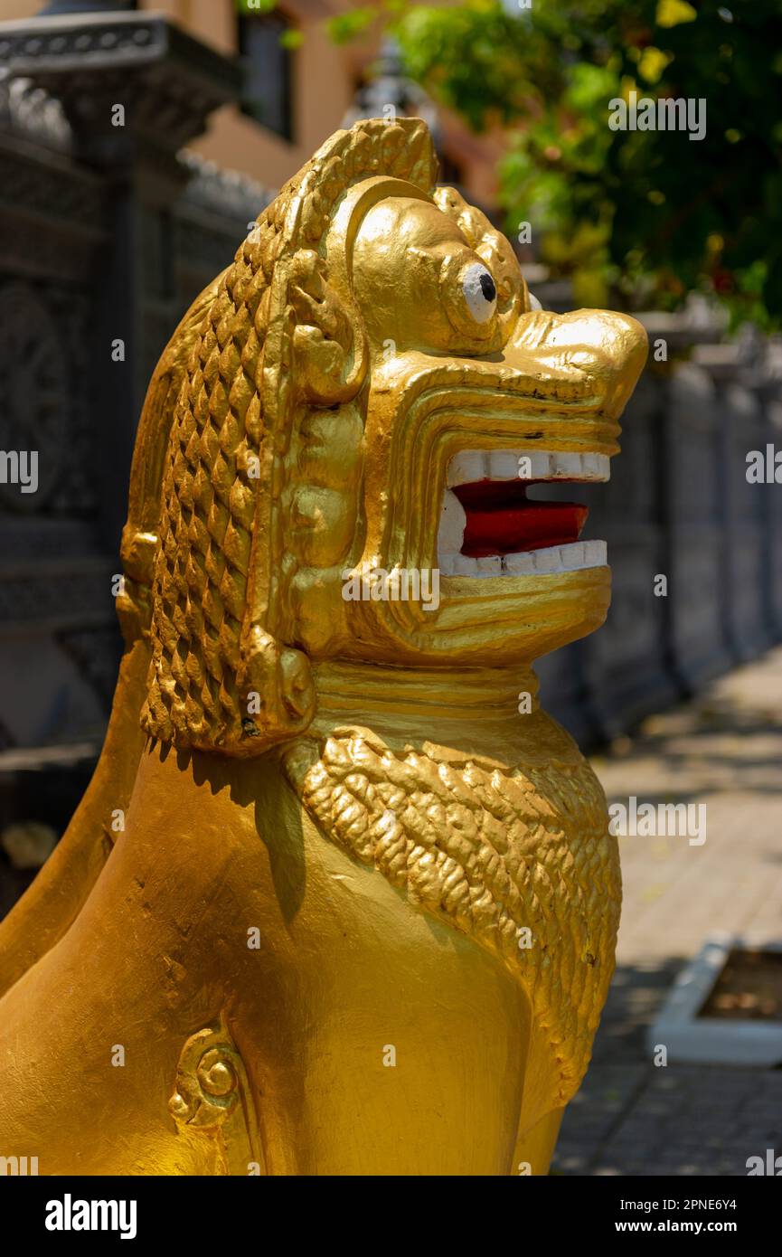 A golden lion at the entrance to Wat Langka, Phnom Penh, Cambodia Stock Photo