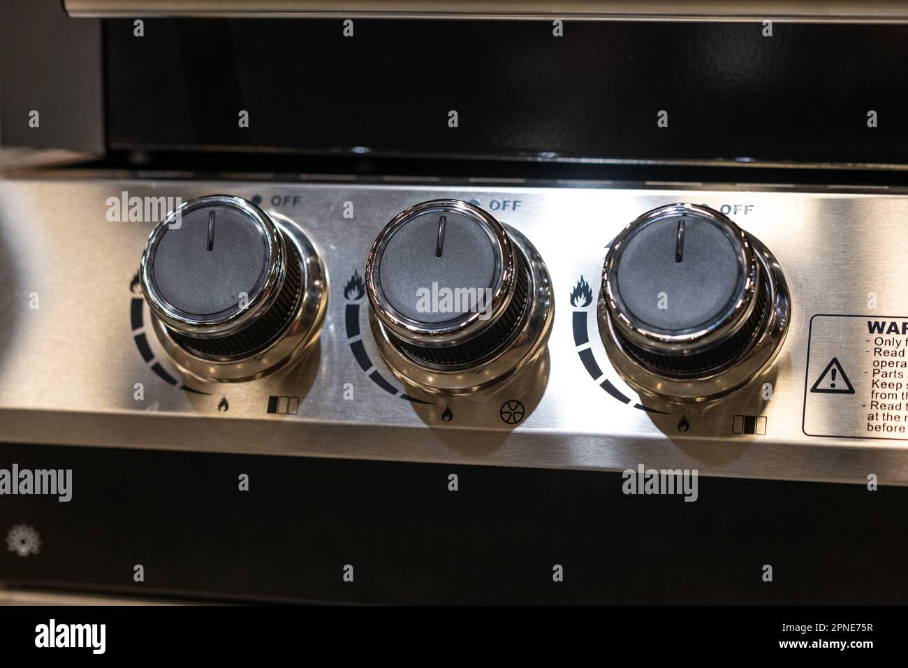 Regulators of a gas grill Stock Photo - Alamy