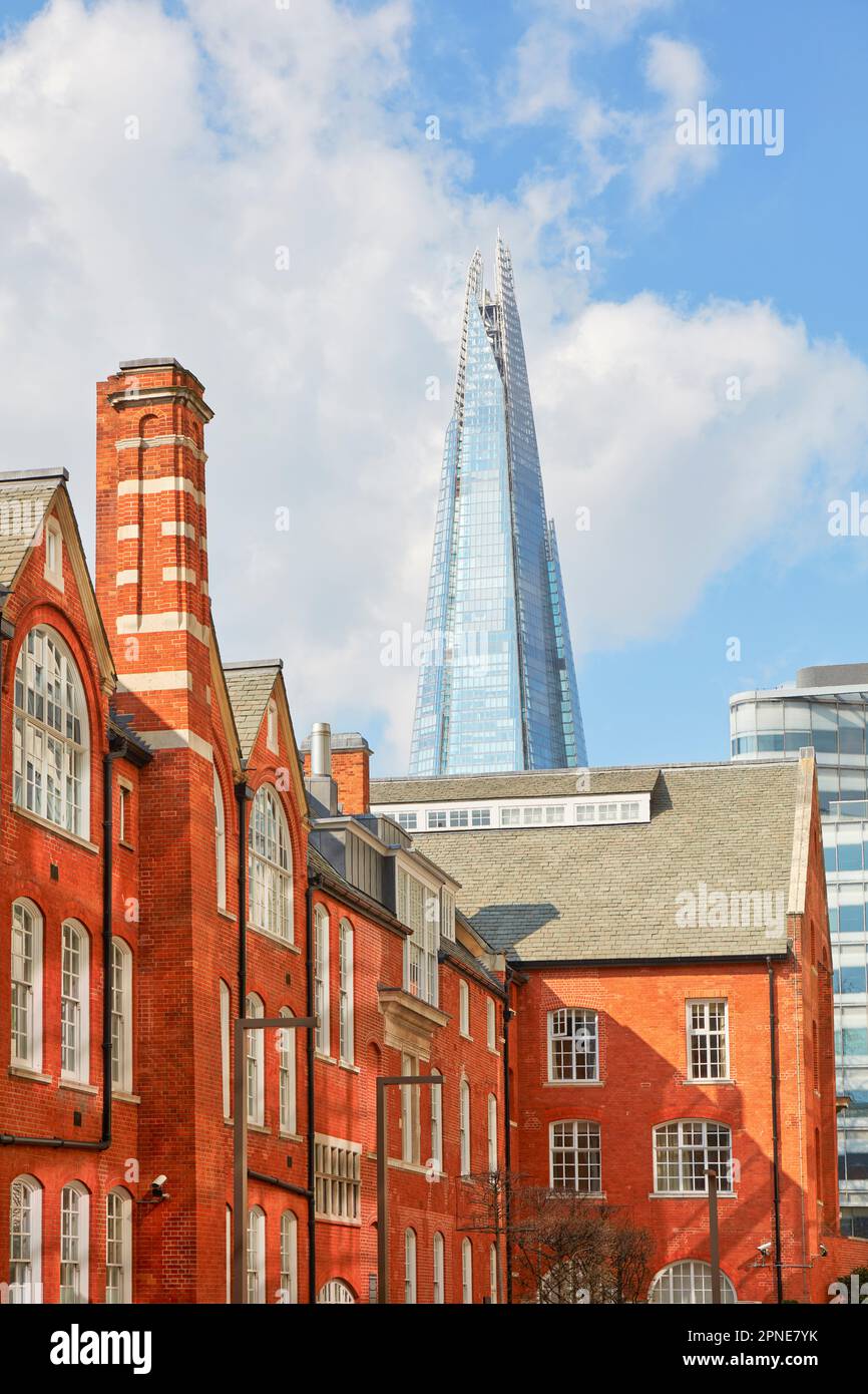 The Victorian architecture 'Lalit London' Luxury Hotel with the Shard Tower in background, Southwark, London, United Kingdom. Stock Photo
