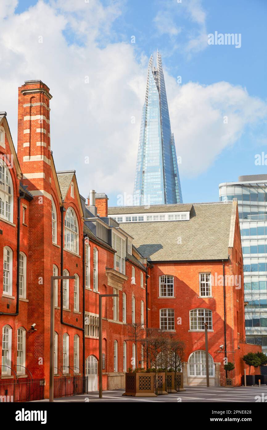 The Victorian architecture 'Lalit London' Luxury Hotel with the Shard Tower in background, Southwark, London, United Kingdom. Stock Photo