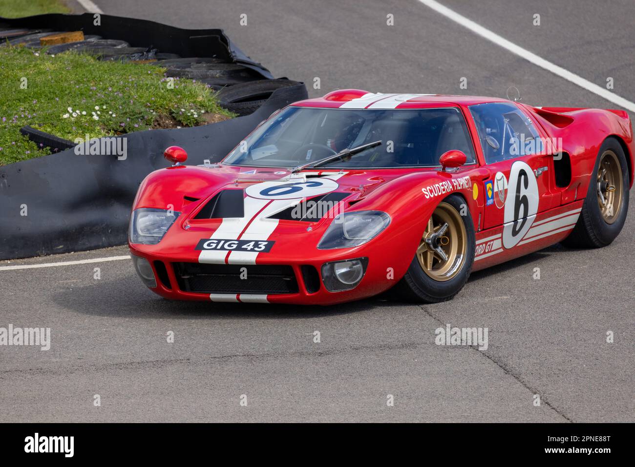 April 2023 - Red Ford GT40 entering the paddock at the Goodwood Members ...