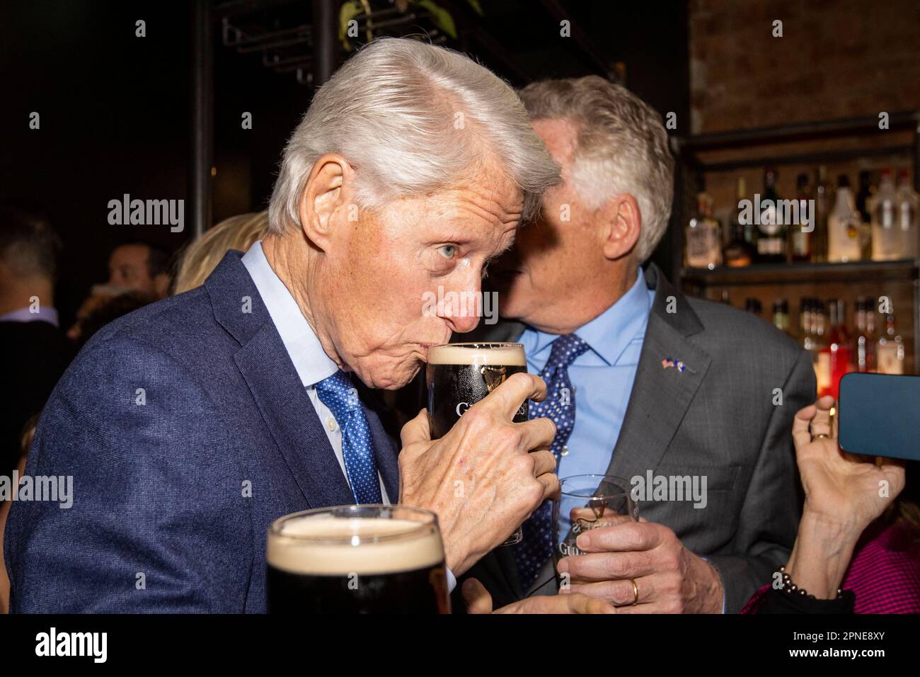 Former US President Bill Clinton drinking a pint of Guinness at the ...