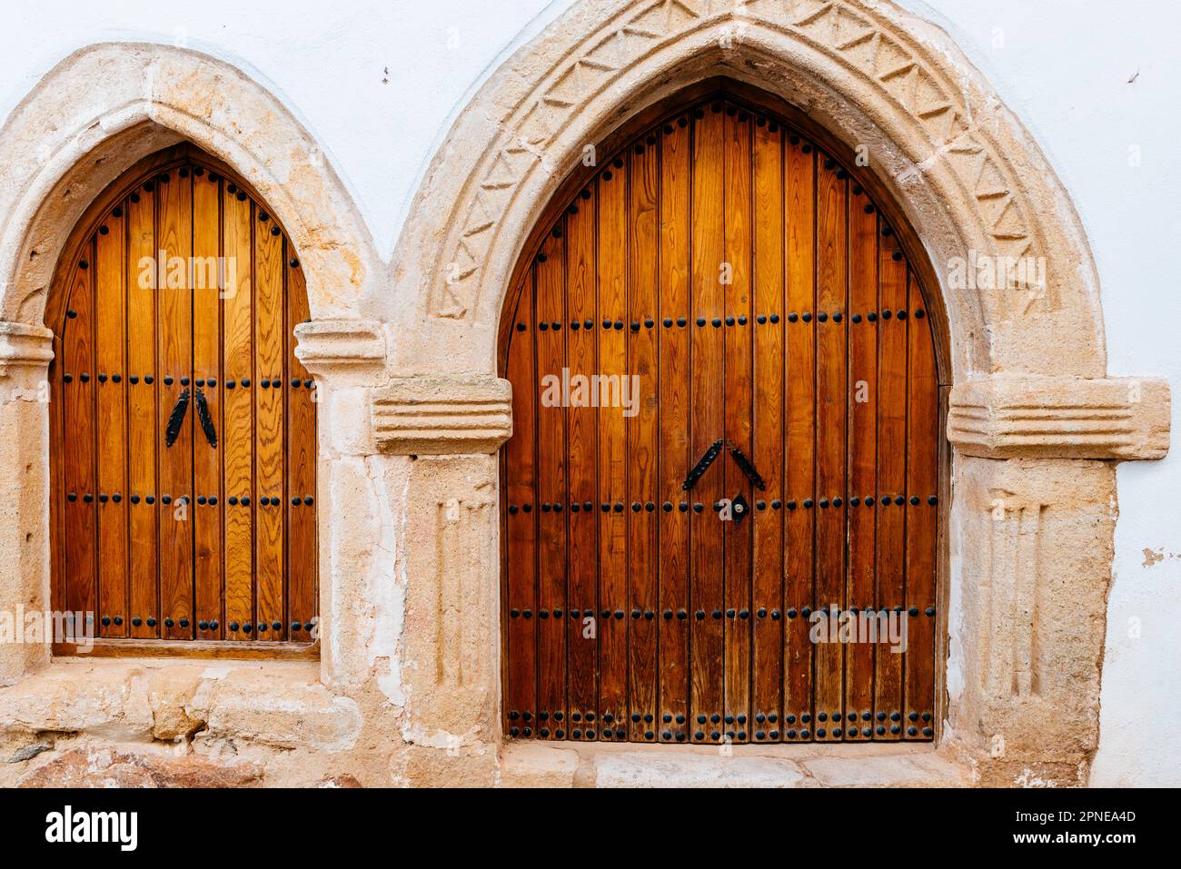 Detail of house doors. Albuquerque medieval quarter street. Medieval neighborhood 'Villa Adentro'. Villa Adentro or Barrio de la Teta Negra. Alburquer Stock Photo