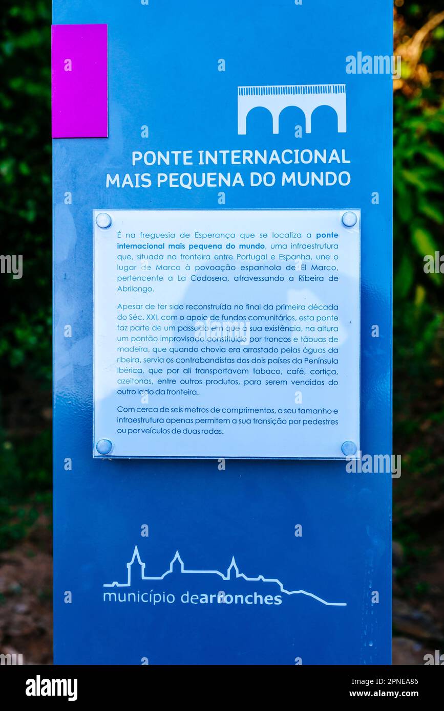 Information plaque about the smallest international bridge in the world. Tourist information poster of the municipality of Arronches, Alto Alentejo, P Stock Photo