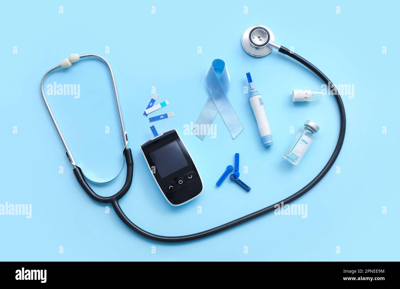 Awareness ribbon with insulin, lancet pen and stethoscope