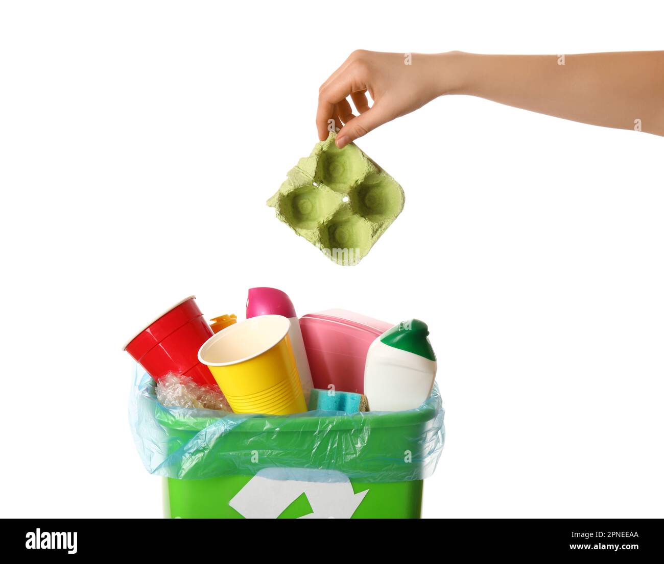 Woman throwing garbage into trash bin on white background Stock Photo ...