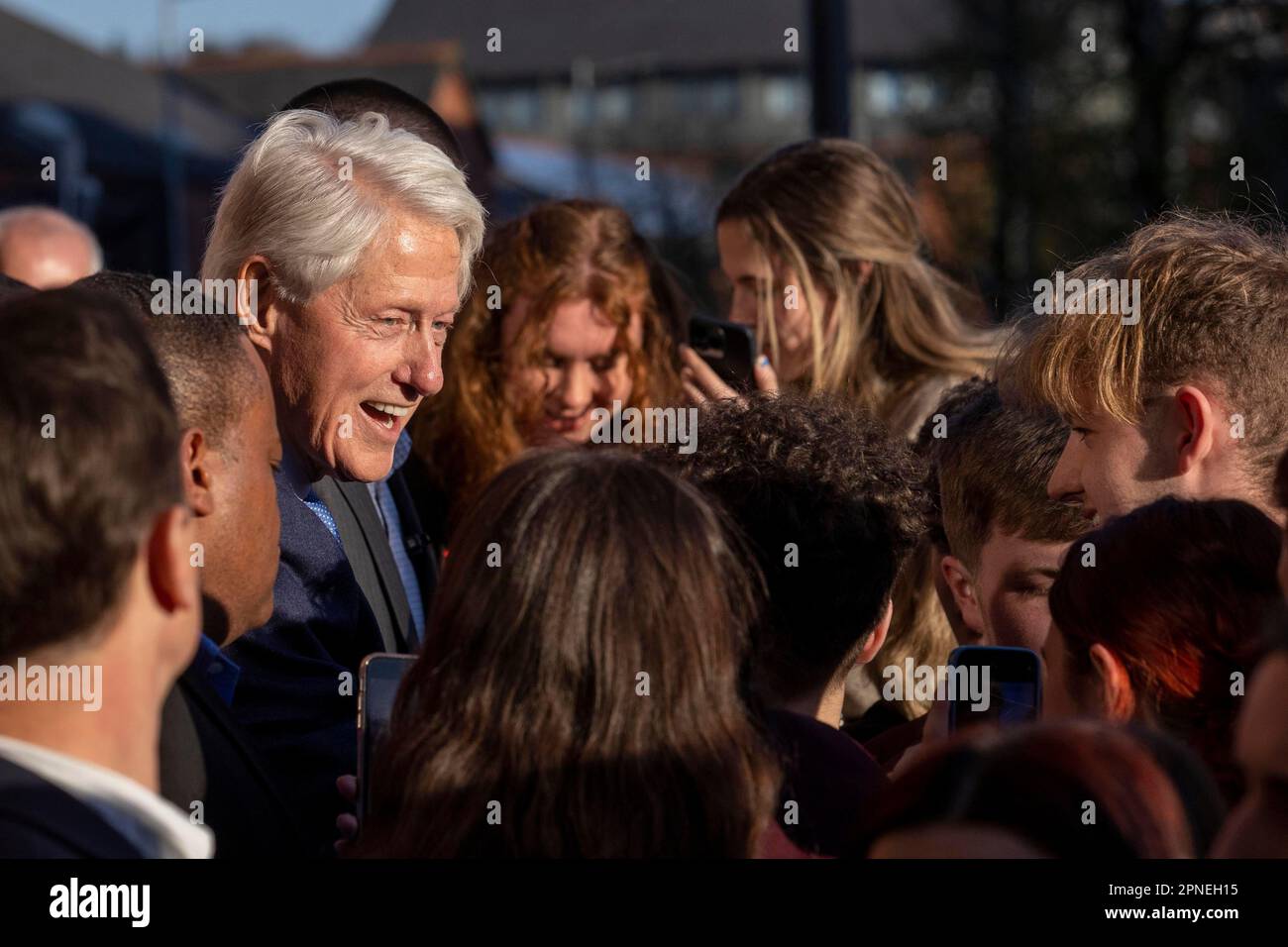 Former US President Bill Clinton poses for selfies in Guildhall Square ...