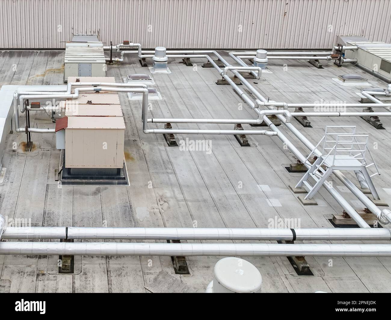 Aerial view of an Industrial looking HVAC equipment and pipes on gray