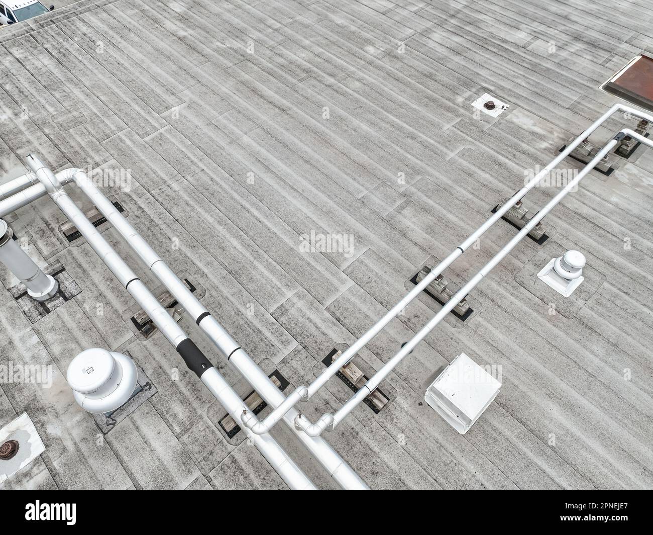Aerial view of an Industrial looking HVAC equipment and pipes on gray