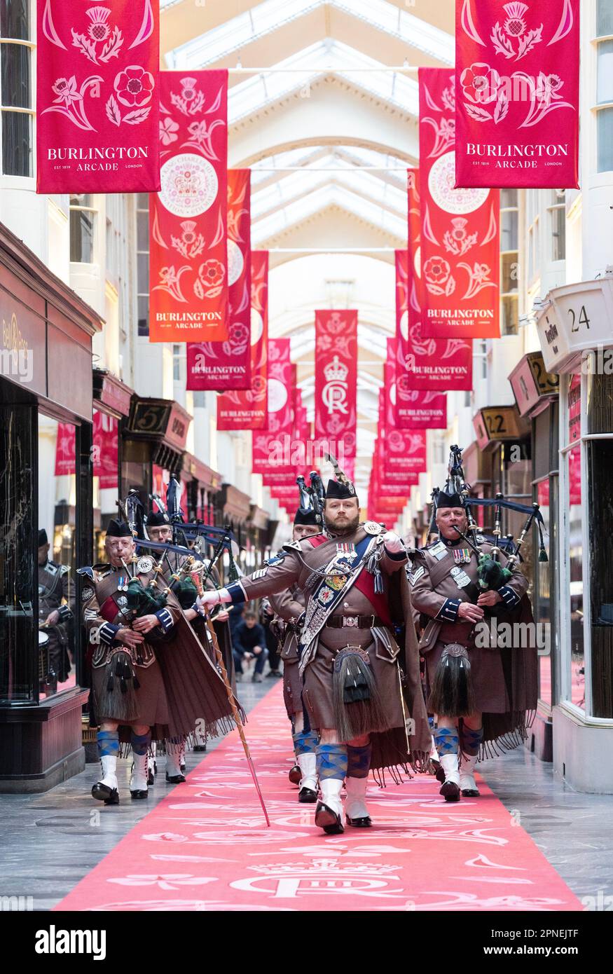 EDITORIAL USE ONLY The London Scottish Band march down Burlington Arcade in London, as it