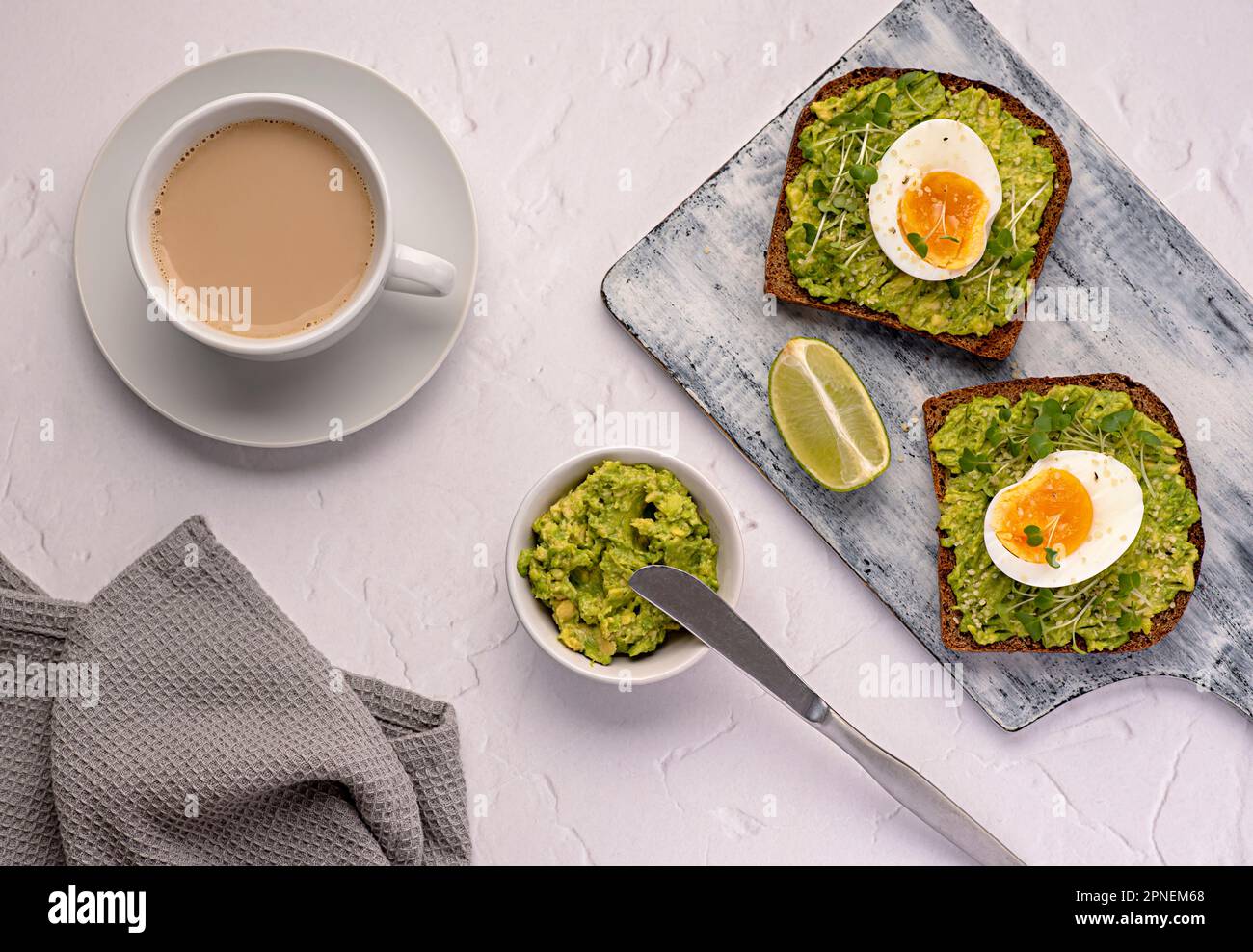 Food photography of sandwich with rye bread, egg, avocado, cress salad