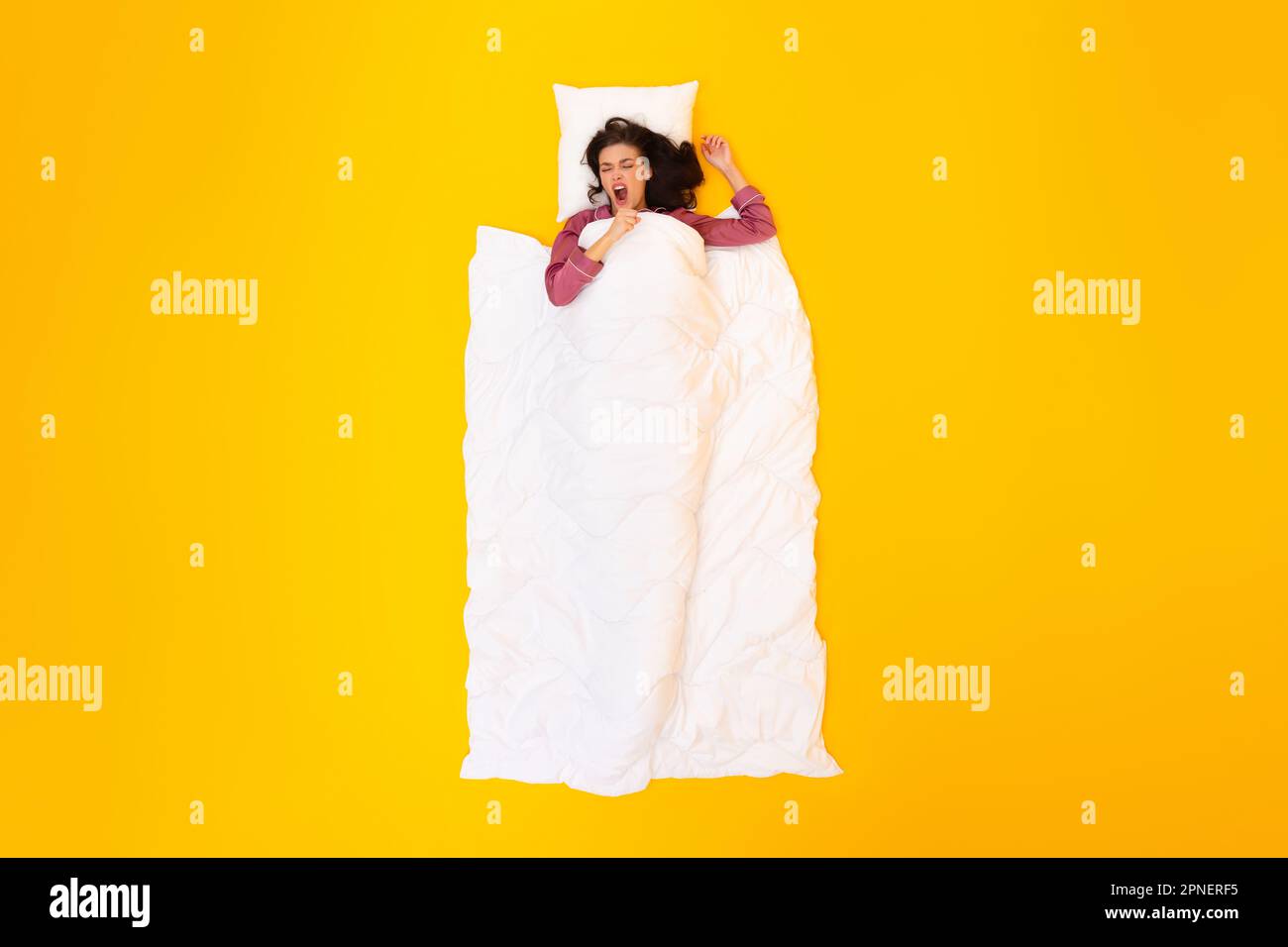 Female Yawning Sleeping Lying Covered With Blanket Over Yellow