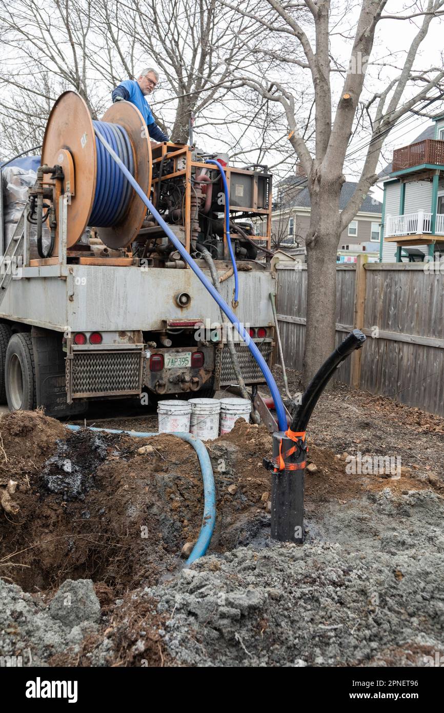 March 17, 2023. Beverly, MA. Grouting of test well.  Installation of a test well to determine existing geothermal groundwater conditions for the Bever Stock Photo