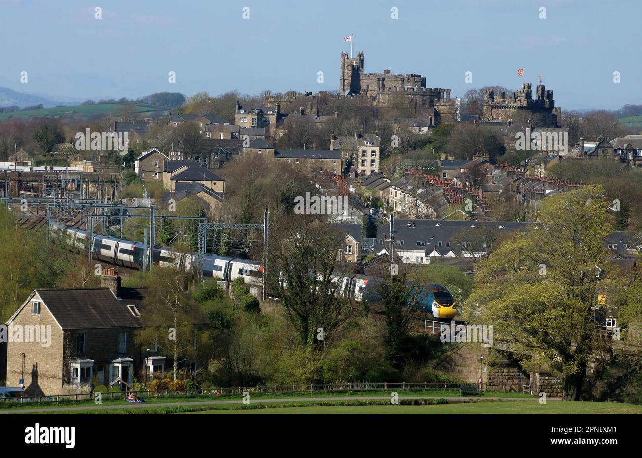 Avanti West Coast pendolino 390132 heads south out of Lancaster on the West Coast Main Line with express passenger service 18th April 2023. Stock Photo