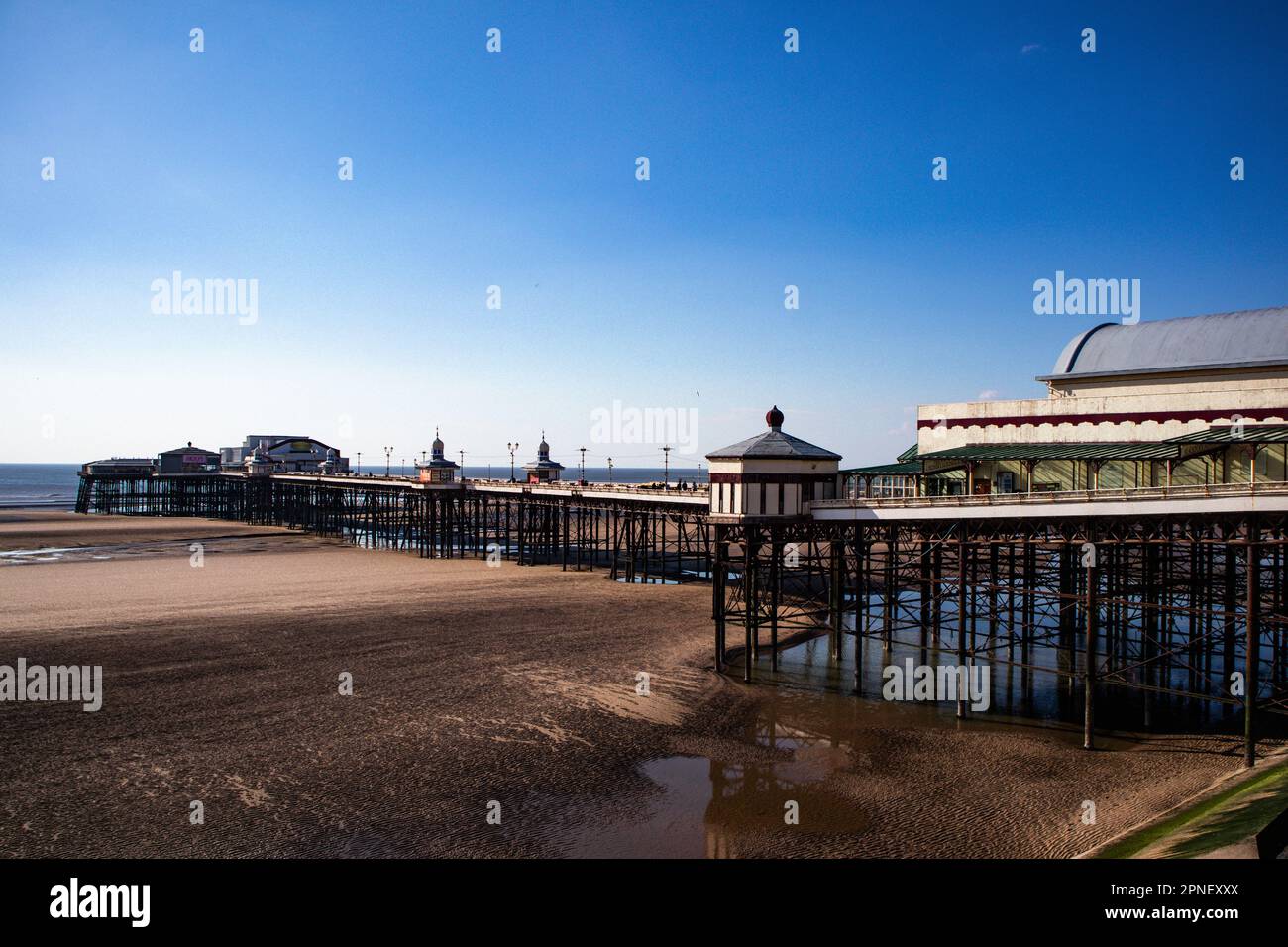 North Pier,  Blackpool Lancashire, United Kingdom, 18th April 2023 North Pier Blackpool bathed in the afternoon Sunshine as the weather starts to brighten up Stock Photo