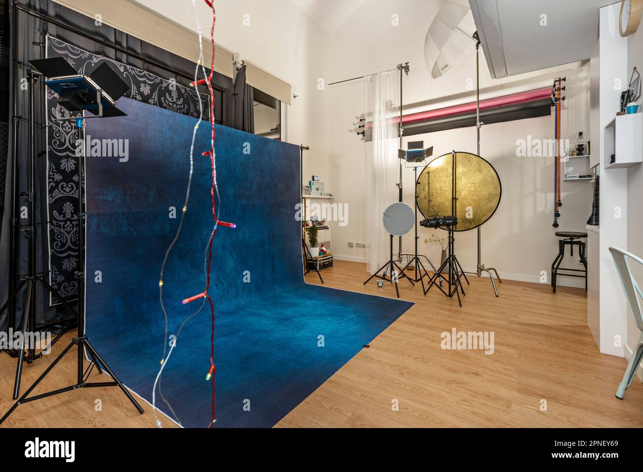 Photography studio with diffusers, backgrounds, spotlights and other
