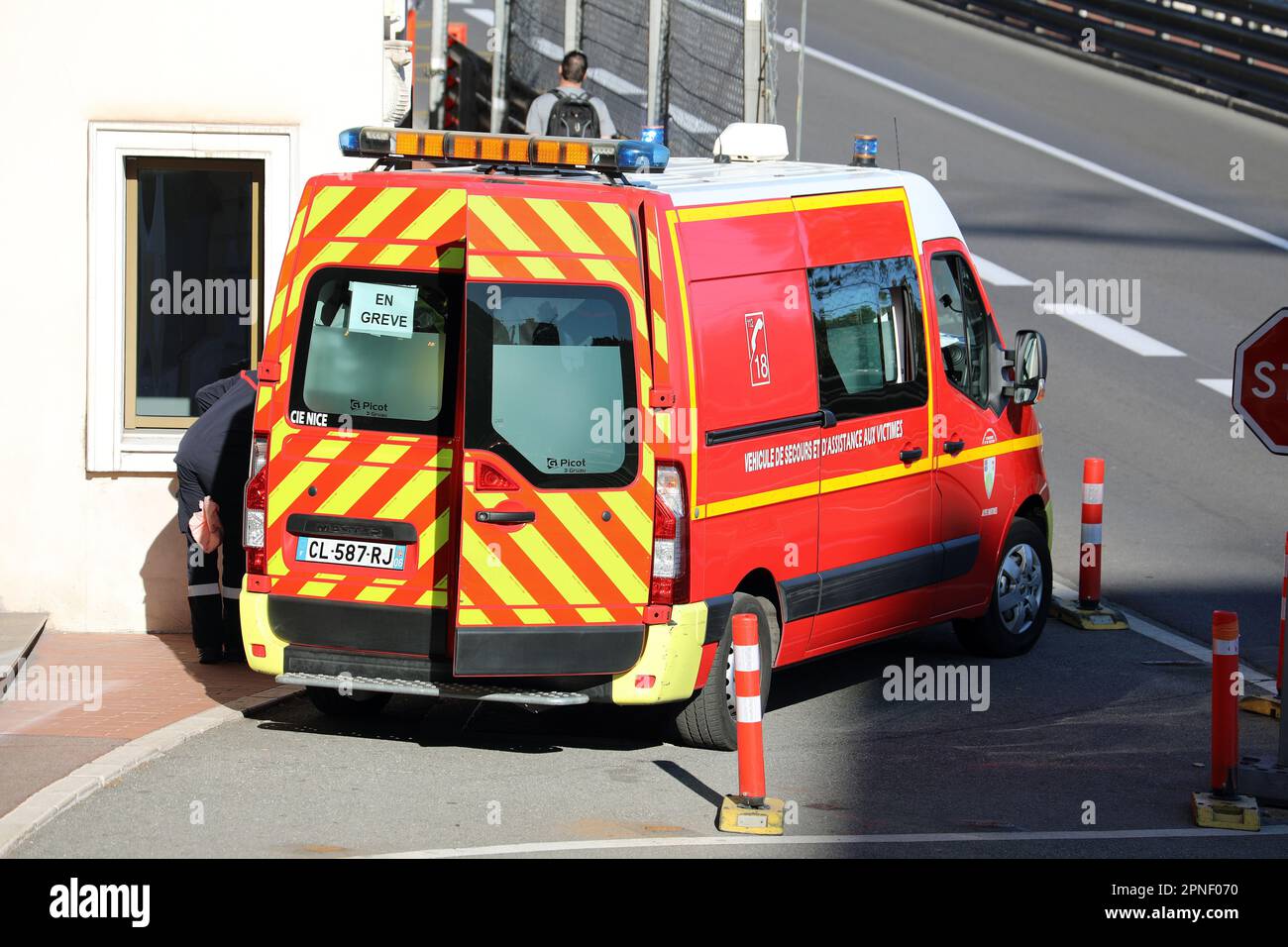 Monte-Carlo, Monaco - April 16, 2023: Rear view of a red Renault Master fire brigade van from France, in action with open doors, responding to an emer Stock Photo