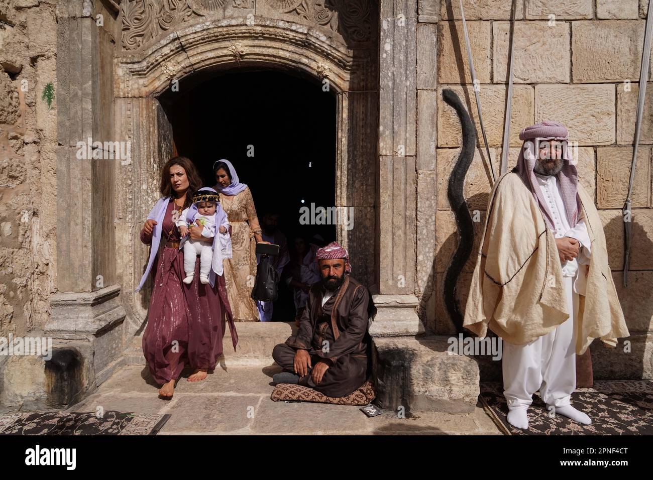 Dohuk, Iraq. 18th Apr, 2023. Iraqi Yazidis gather at the Lalish mountain valley and temple, the holiest shrine of the Yazidis, to celebrate the Red Wednesday, which marks the beginning of spring and the first day of the new year in the Yazidi faith. Credit: Ismael Adnan/dpa/Alamy Live News Stock Photo