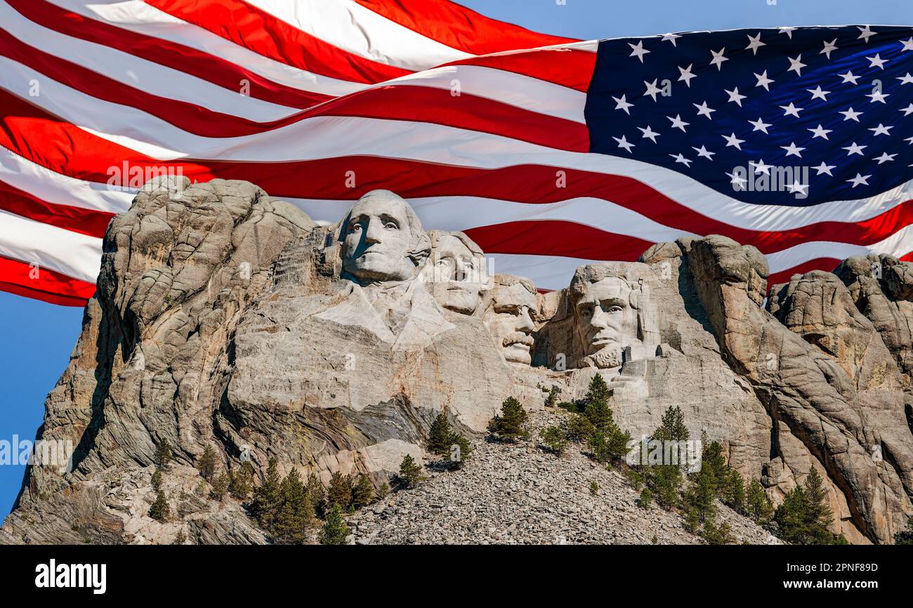 United States, South Dakota, Mount Rushmore with American flag in background Stock Photo