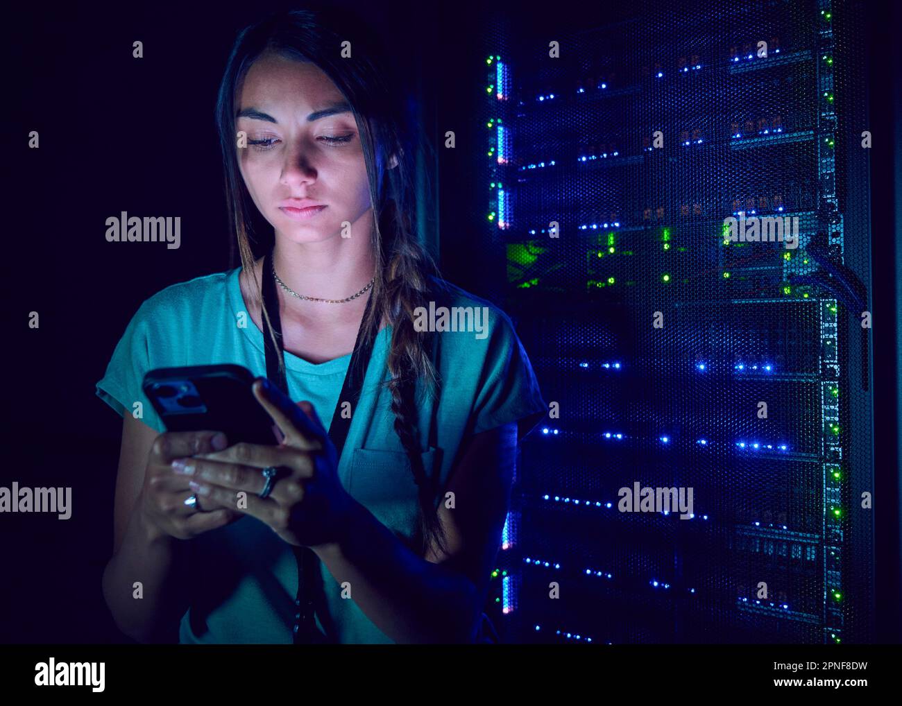 Female technician using smart phone in server room Stock Photo Alamy