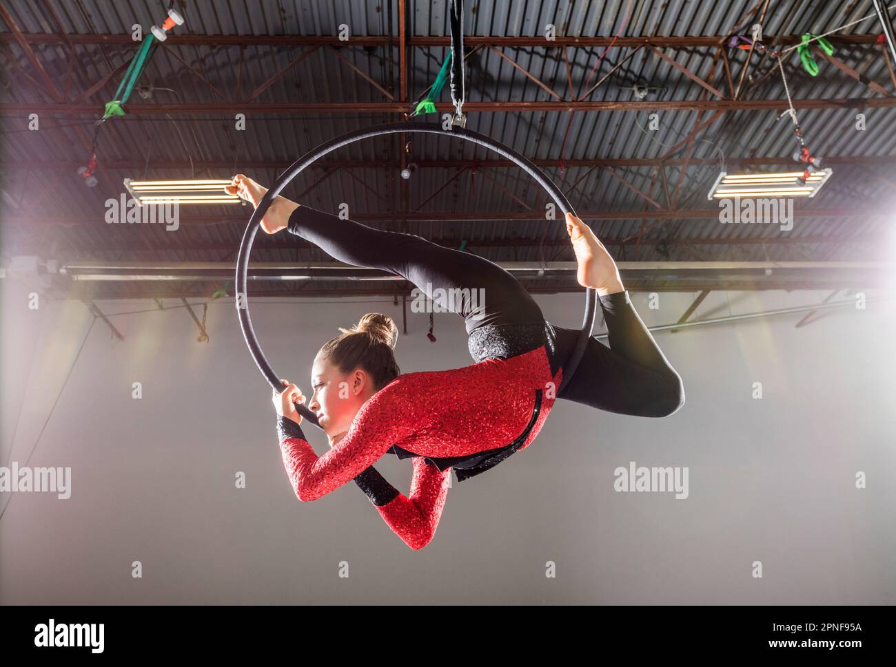 Teenage girl (14-15) practicing aerial dancing Stock Photo