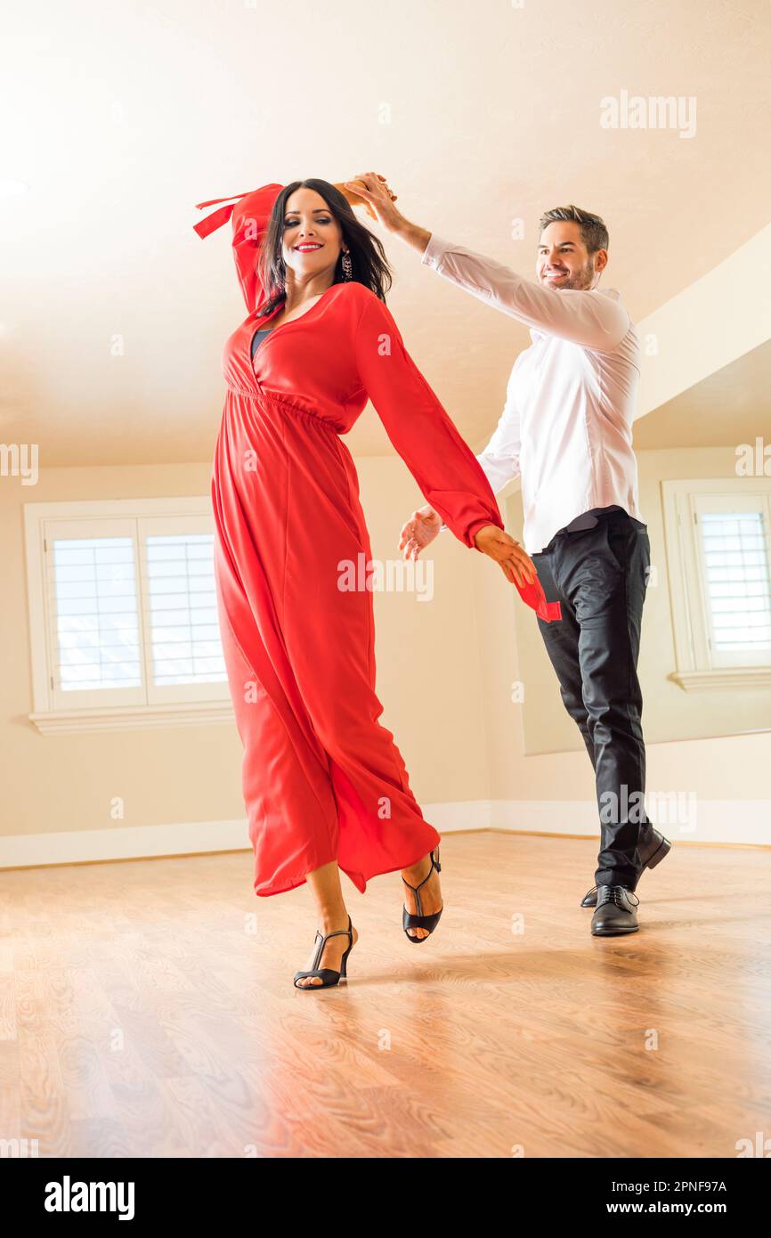 Couple dancing in empty apartment Stock Photo