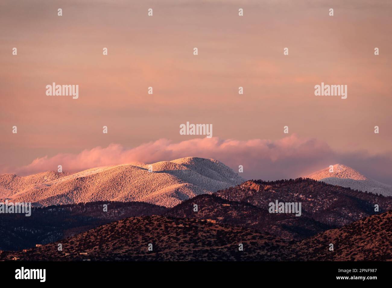 United States, New Mexico, Santa Fe, Evening light over snowcapped Sangre de Cristo mountains Stock Photo