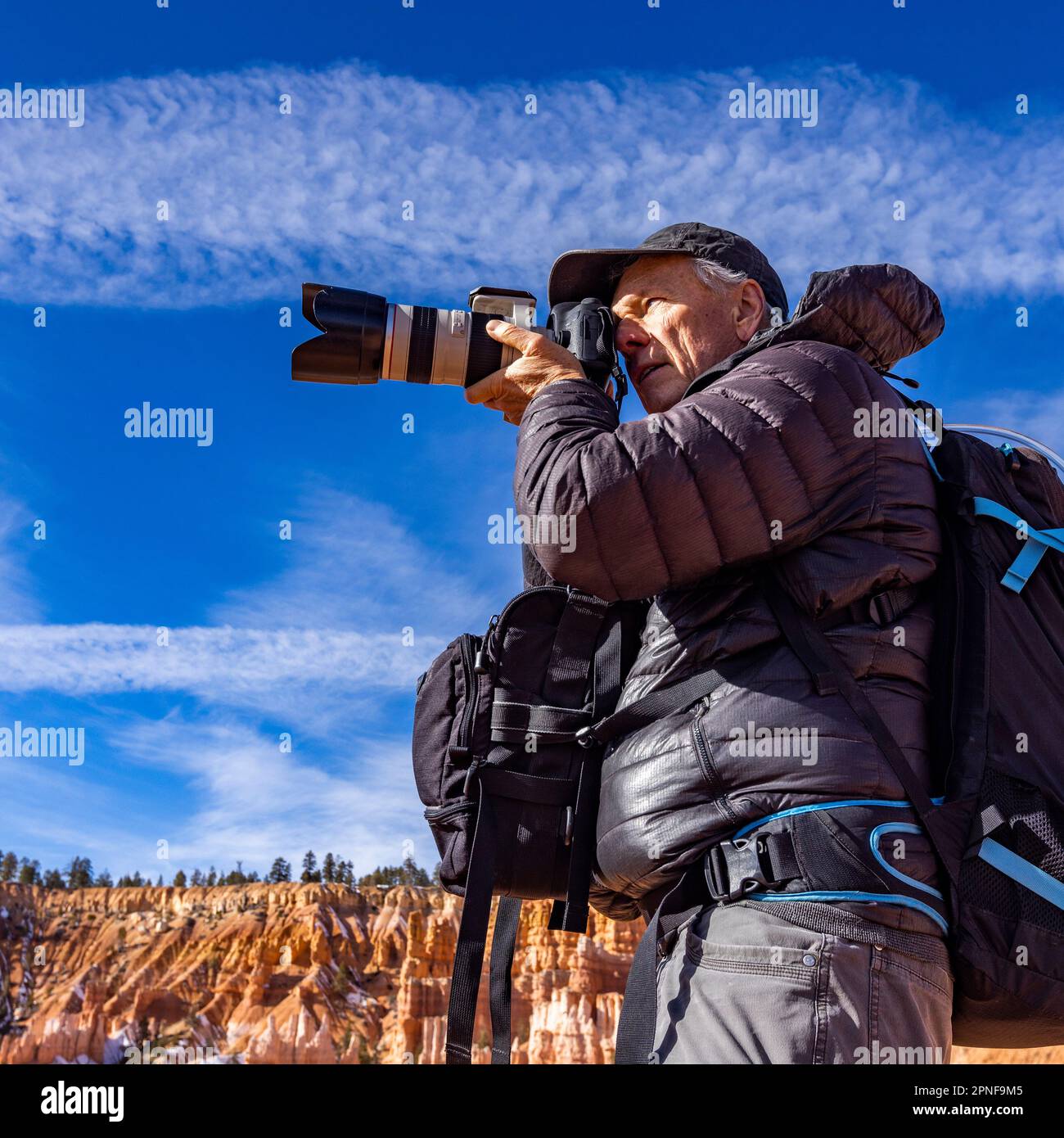 United States, Utah, Senior photographer photographing in Zion National Park Stock Photo
