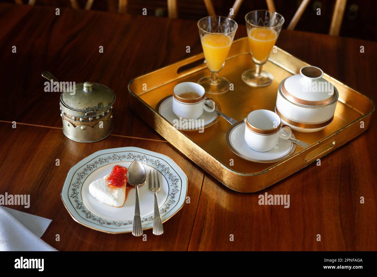 Antique tray with coffee and orange juice Stock Photo