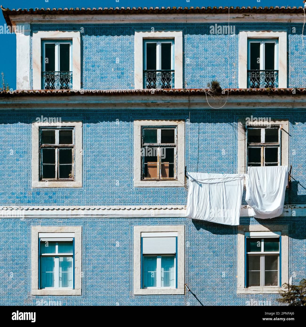 Portugal, Lisbon, Typical Portuguese Pombaline building with laundry hanging to dry Stock Photo