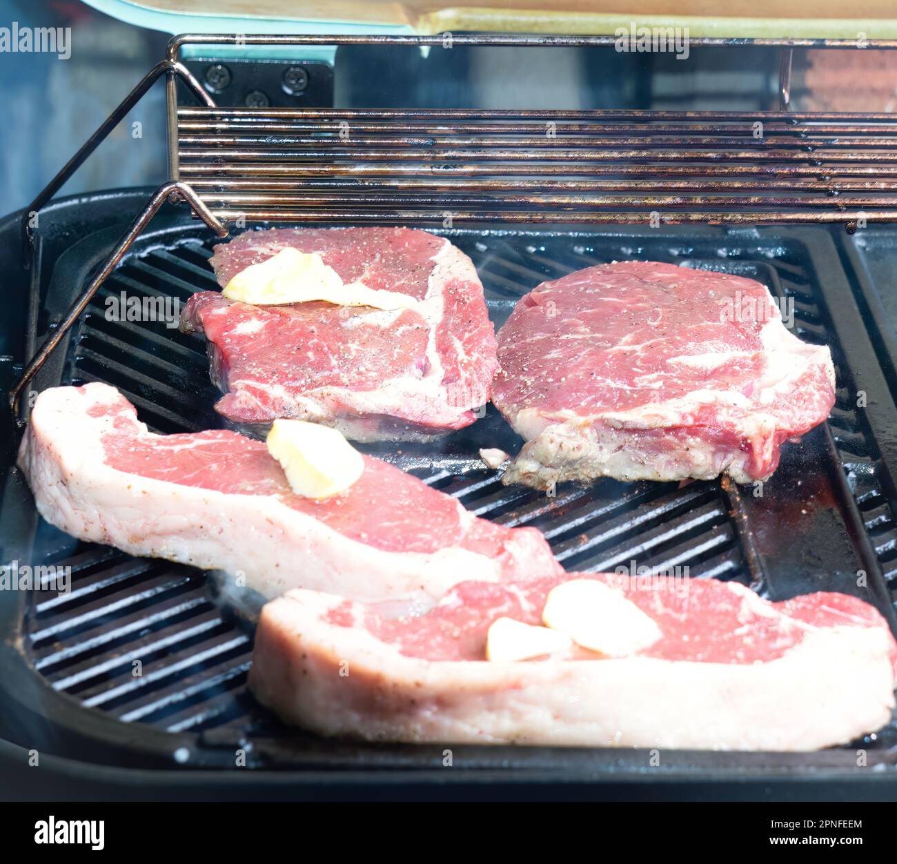 Porterhouse & Scotch Fillet Grilling On The BBQ Stock Photo Alamy