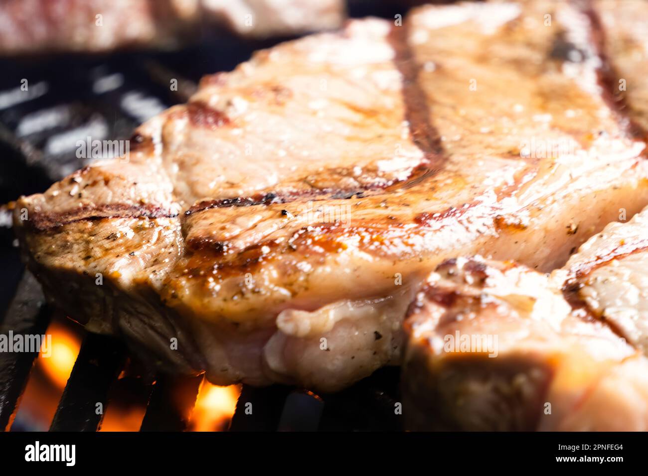 Porterhouse Steaks Grilling On The BBQ Stock Photo Alamy