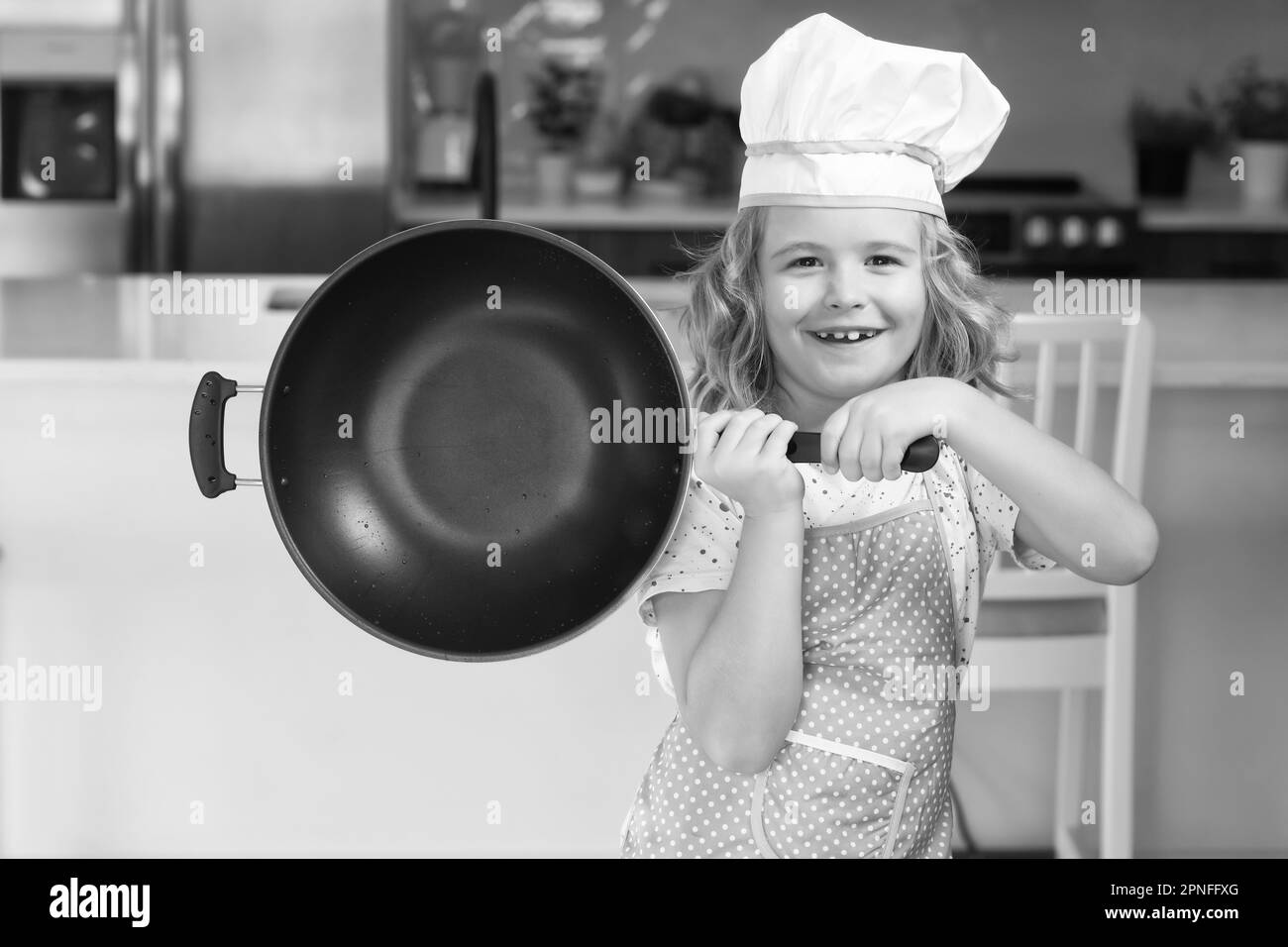 https://c8.alamy.com/comp/2PNFFXG/kid-chef-cook-cookery-with-pan-in-kitchen-chef-kid-cook-baking-at-home-kitchen-kid-chef-cook-cookery-at-kitchen-cooking-culinary-and-kids-little-2PNFFXG.jpg