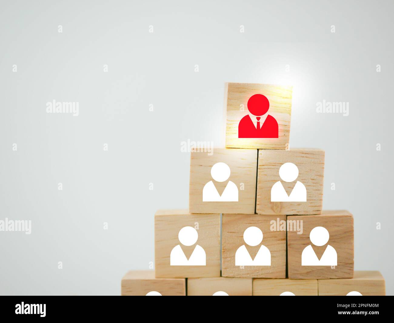 Wooden blocks with people icons. Concept of leadership, manager, executive position, HR concept, recruitment, human resources and management. Stock Photo