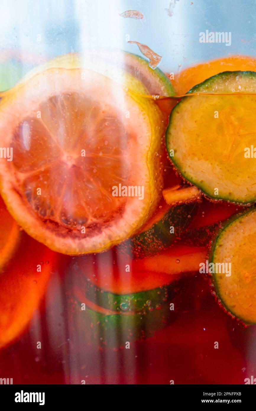 fruit punch in a drink dispenser at a party Stock Photo - Alamy