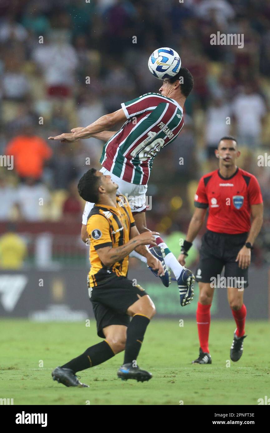 Rio de Janeiro, Brazil, 18th Apr, 2023. Paulo Henrique Ganso of Fluminense battles for possession with Jose Flores of The Strongest, during the match between Fluminense and The Strongest for the 2st round of Group D of Libertadores 2023, at Maracana Stadium, in Rio de Janeiro, Brazil on April 18. Photo: Daniel Castelo Branco/DiaEsportivo/Alamy Live News Stock Photo