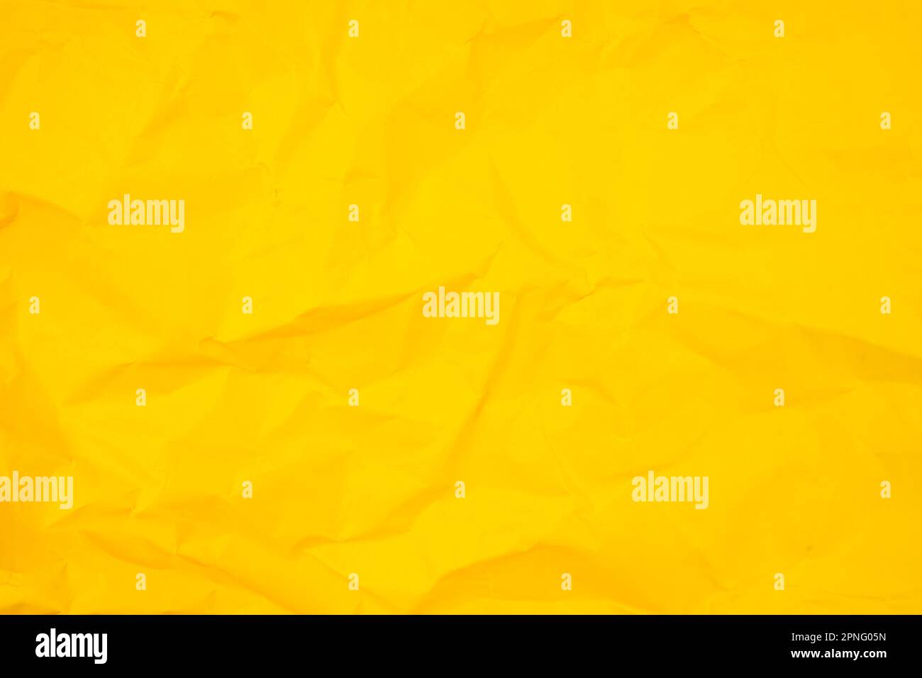 Abstract background from crumpled yellow paper texture. Stock Photo
